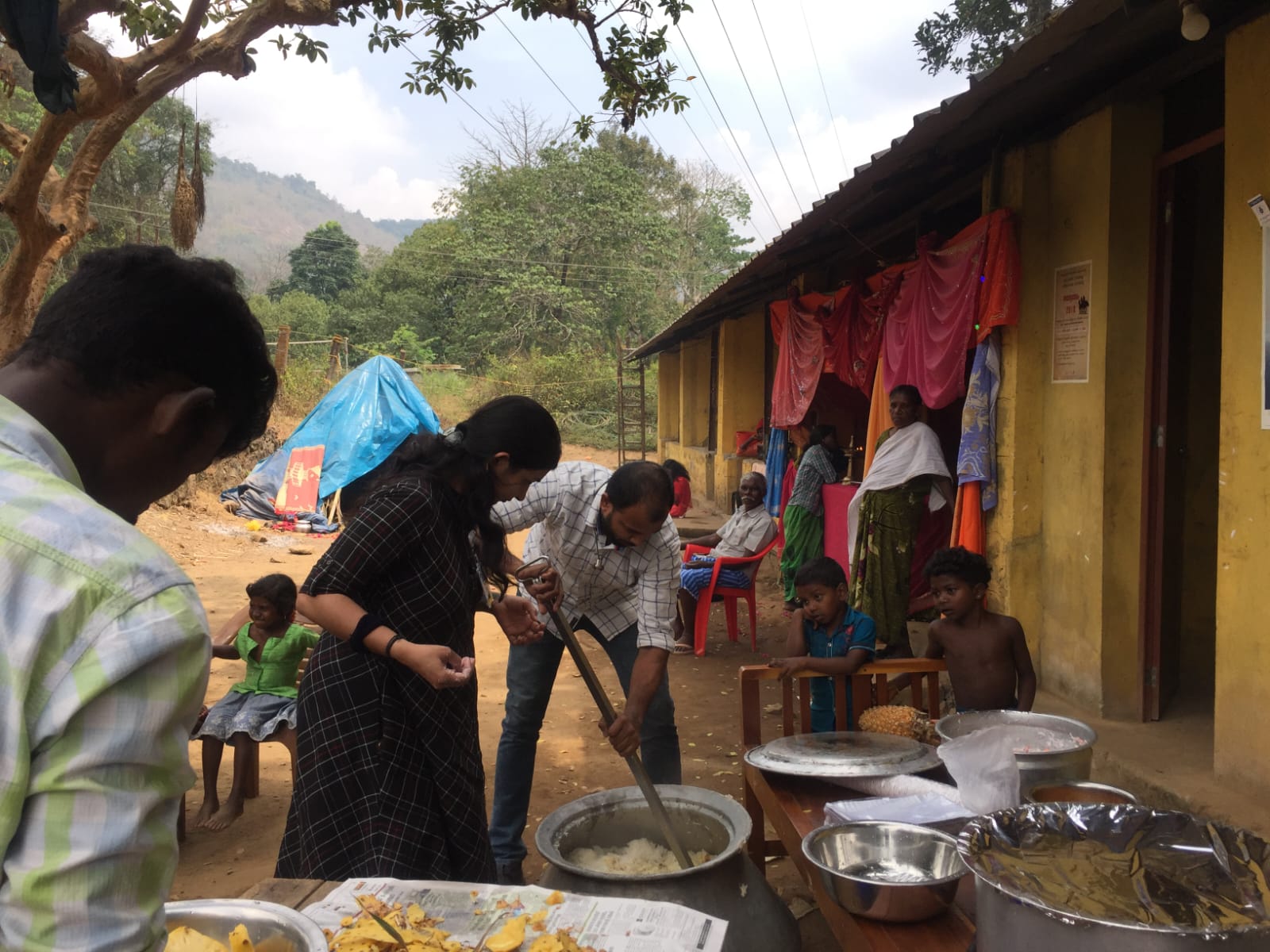 Volunteers preparing a shared community meal